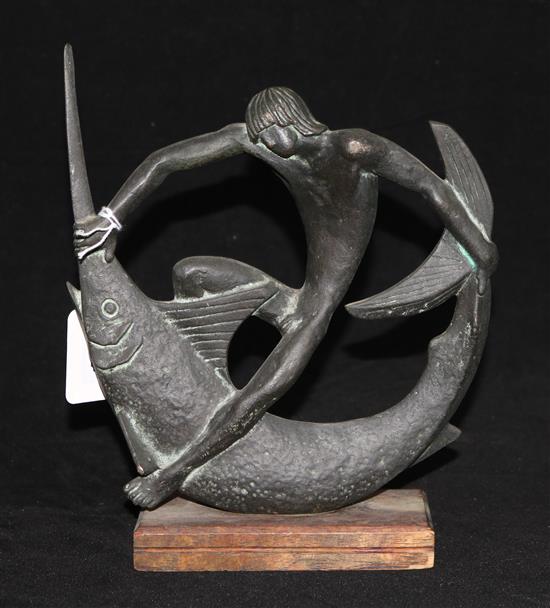 A bronze figure of a man with a marlin